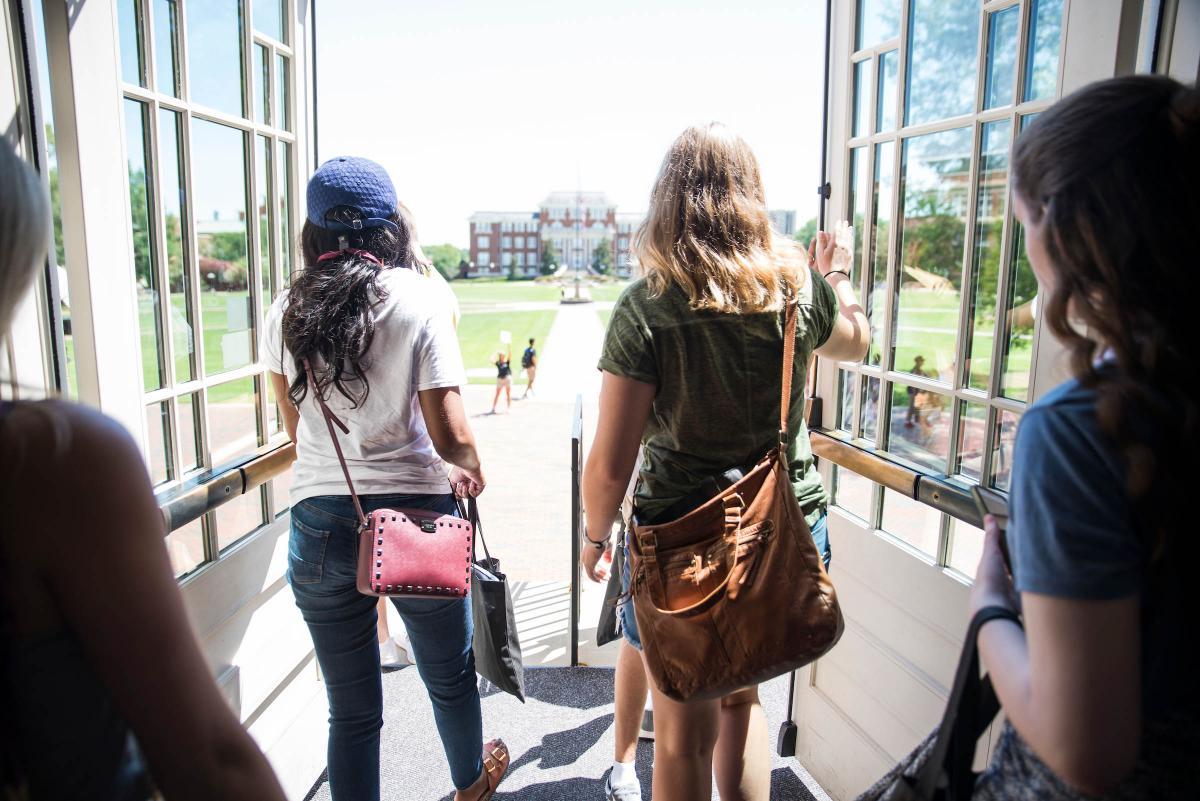 Students walk out of building during orientation